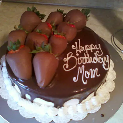 Chocolate covered strawberries on a cake