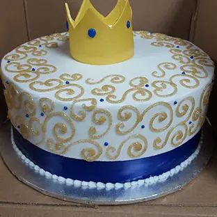 A crown cake with gold scrollwork