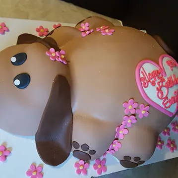 A pink puppy cake