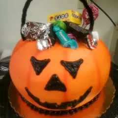 A jack-o-lantern bucket of candy