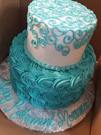 Teal tiers with white scrollwork