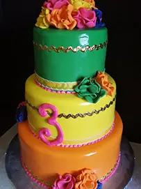Bright orange, green, and pink tiers with flowers