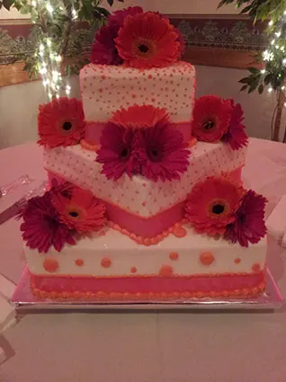Square tiers with pink gerbera daisies