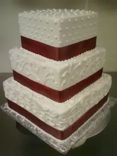 Square tiers with burgundy ribbon and pearl dots